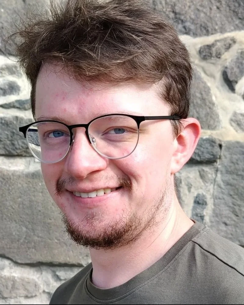 Connor Babbington, smiling, outdoors